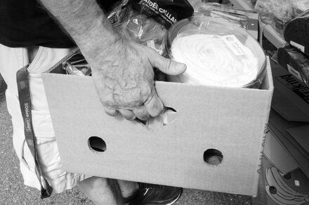 A child looking at an empty bowl, symbolizing a new era of hunger.