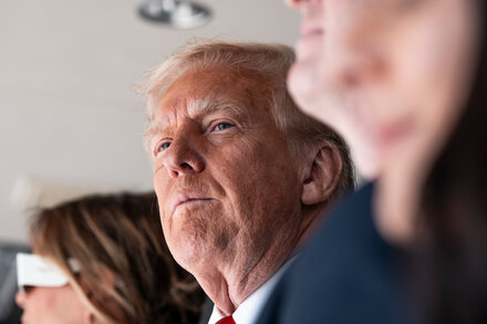Donald Trump with a stern expression, symbolizing the impact of rising tariff rates.