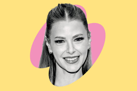 Ariana Madix smiling widely and looking directly at the camera, with a bright background