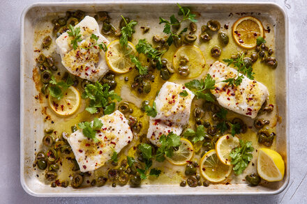 Baked fish with olives and ginger, a dish featured in an article also covering Ina Garten’s Perfect Roast Chicken and One-Pot Shrimp Pulao.
