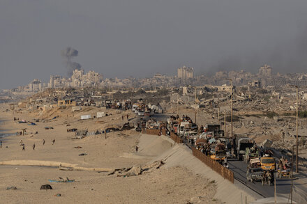 An aerial view of a densely populated area in Gaza, showing damaged buildings and streets.