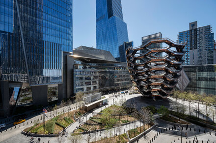 Aerial view of Hudson Yards skyscrapers in New York City with construction cranes in the foreground