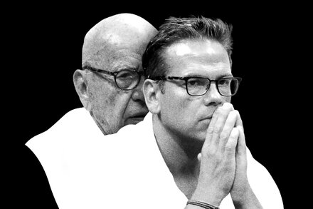 Lachlan Murdoch in a suit, looking contemplative, against a blurred background.