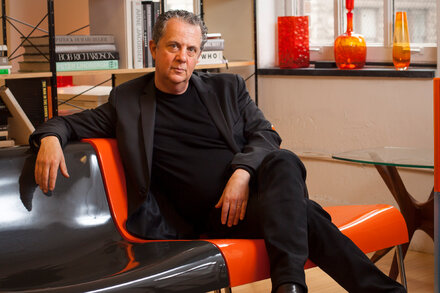 Neil Kraft, the visionary adman known for his work with Calvin Klein, DKNY, and Barneys New York, who died at 67, is shown in a black and white portrait.