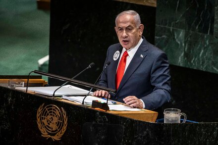 Benjamin Netanyahu, Prime Minister of Israel, speaking at the United Nations General Assembly with a serious expression.