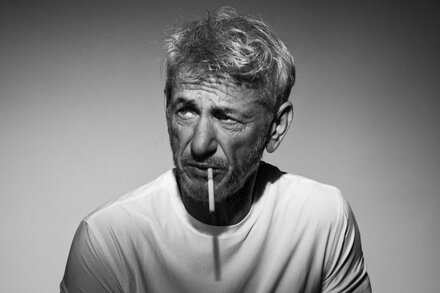Sean Penn with a serious expression looking directly at the camera