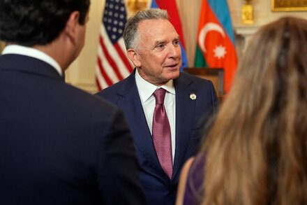 Portrait of Steve Witkoff looking thoughtful or determined, possibly in an office setting or in front of one of his properties, representing his financial empire.