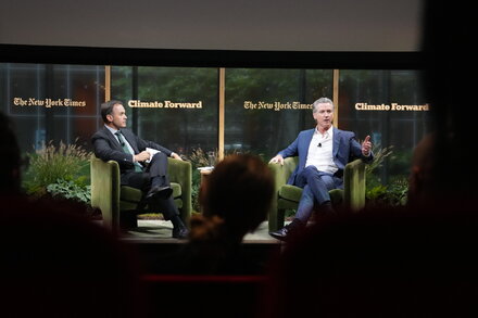 A group of world leaders on a panel discussing global issues.