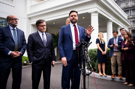 A close-up of a broken and tangled red tape, symbolizing bureaucratic hurdles and a government shutdown, set against a blurred background of official-looking documents.
