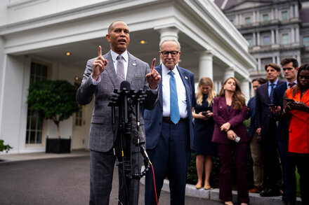A visual representation of the U.S. government, possibly with gears or a shutdown indicator, illustrating the concept of a government shutdown and related political rhetoric.
