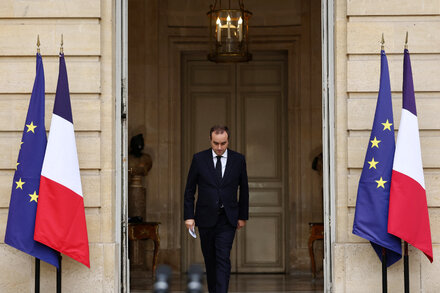 Emmanuel Macron, the President of France, looking concerned during a press conference about the resignation of another prime minister amid economic fears.