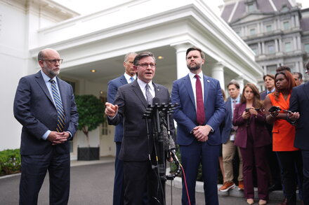 House Speaker Mike Johnson speaks at a press conference, with other Republican lawmakers in the background, discussing government funding and the looming shutdown.