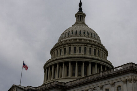 Capitol Building at dusk with a looming, dark sky, symbolizing an impending government shutdown