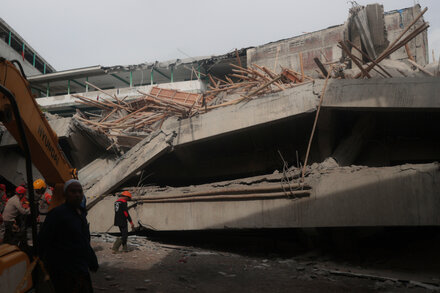 Rescuers search through the rubble of a collapsed school building in Indonesia, looking for trapped students.