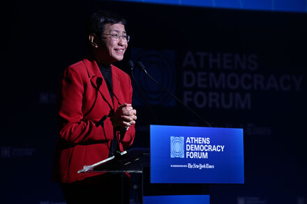 Maria Ressa speaks at a conference about information integrity and democracy, with a focus on misinformation and its impact.