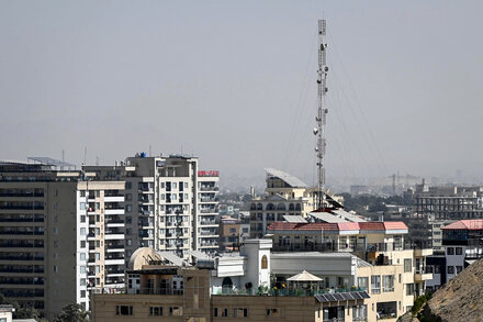 Satellite dish against a stormy sky, symbolizing internet disruption in Afghanistan