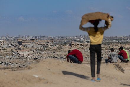 Negotiators from Israel and Hamas engaged in talks, potentially in a neutral location, with a visible sense of tension or intense focus on their faces.