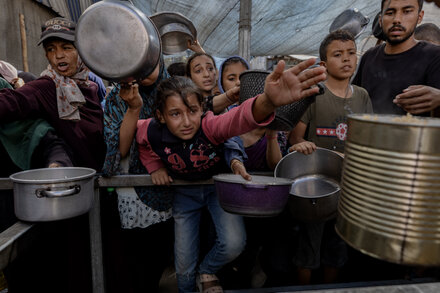 Aid workers prepare supplies for Gaza under cease-fire conditions, focusing on urgent relief amidst humanitarian crisis.