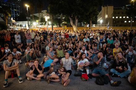 Israeli and Hamas officials preparing for talks, with a backdrop hinting at a peace plan.