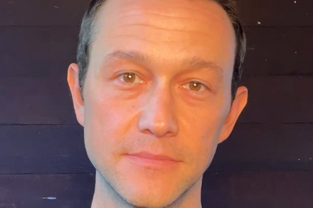 Joseph Gordon-Levitt looking concerned, possibly in discussion about AI, with a blurred background.