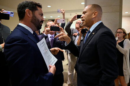 Representative Michael Lawler confronts House Minority Leader Hakeem Jeffries in the U.S. Capitol, showing a tense exchange between the two politicians.