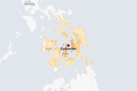 Map showing the location of a 6.9-magnitude earthquake near the Philippines, with concentric circles indicating seismic waves.
