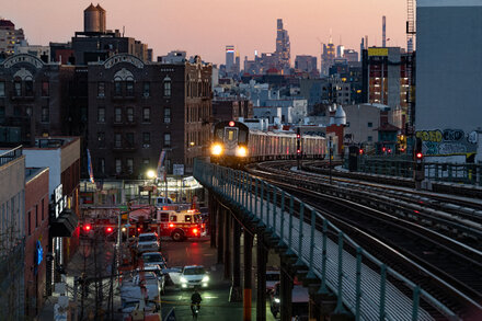 New York City street scene with diverse people and iconic buildings, hinting at a quiz about being a true New Yorker
