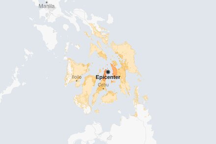Satellite image showing the Visayan Sea region of the Philippines, with a red circle indicating the epicenter of a recent earthquake. The landmasses are visible, and the sea appears dark blue.