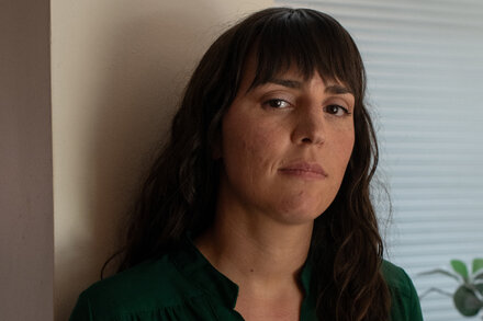 Therapist Jennifer Chiles, who is suing Colorado over its conversion therapy law, sits in an office.