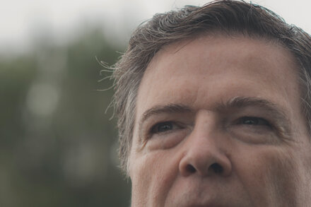 Split image of Donald Trump on the left and James Comey on the right, both looking serious. Trump is in a suit, Comey is also in a suit.