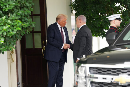 Donald Trump with a serious expression, gesturing as if explaining a complex plan, overlaid with subtle graphical elements suggesting a blueprint or strategy.