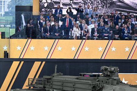 Donald Trump with military personnel, symbolizing the intersection of the military, politics, and historical figures like the Founding Fathers discussed in the article.